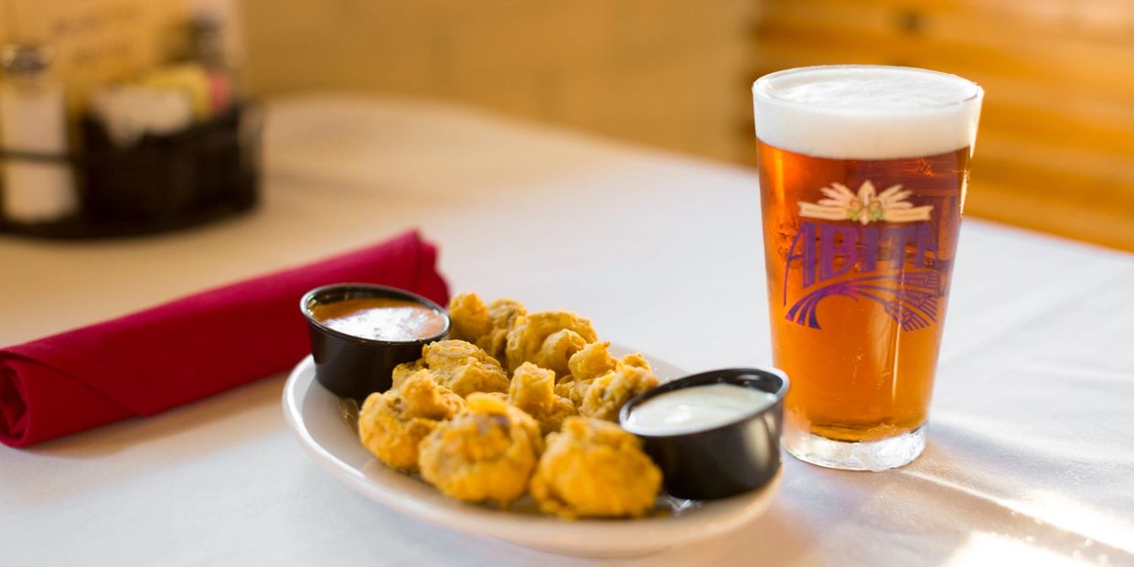 Top view of a pate on table with a glass of drink