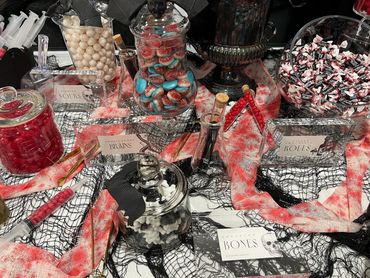 Halloween candy display with spooky decorations