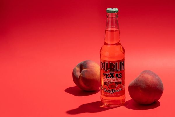 food photography waco, texas - a picture of a bottle of soda, peach flavored soda with peaches