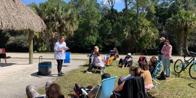 a woman talking to other women during an activity
