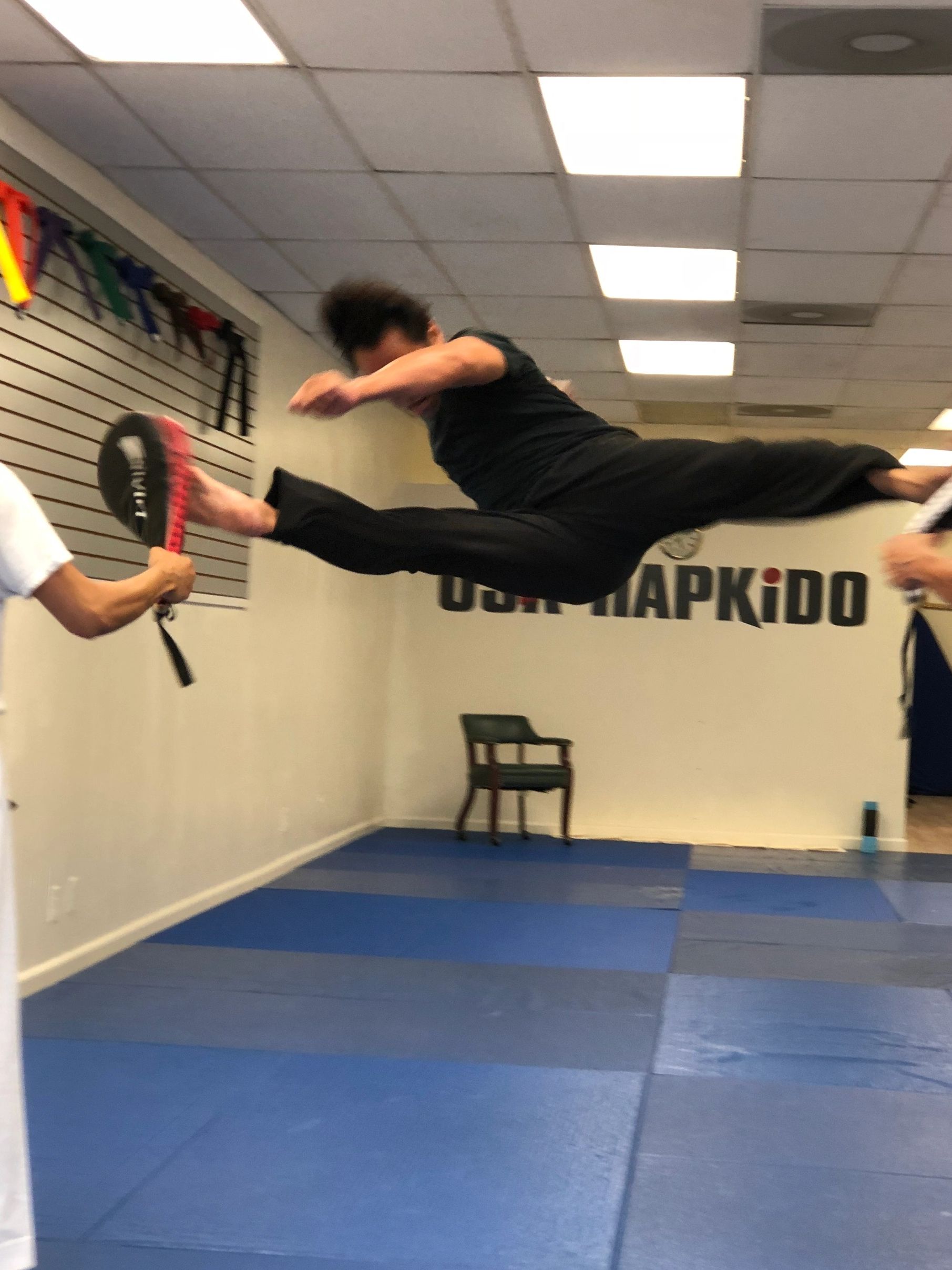 Signature Hapkido scissor kick.