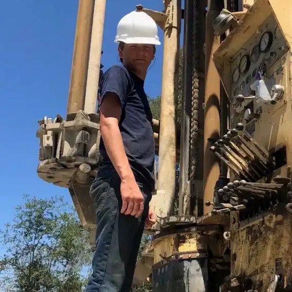 Construction worker operating heavy machinery.