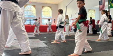 Children practicing martial arts in a dojo.