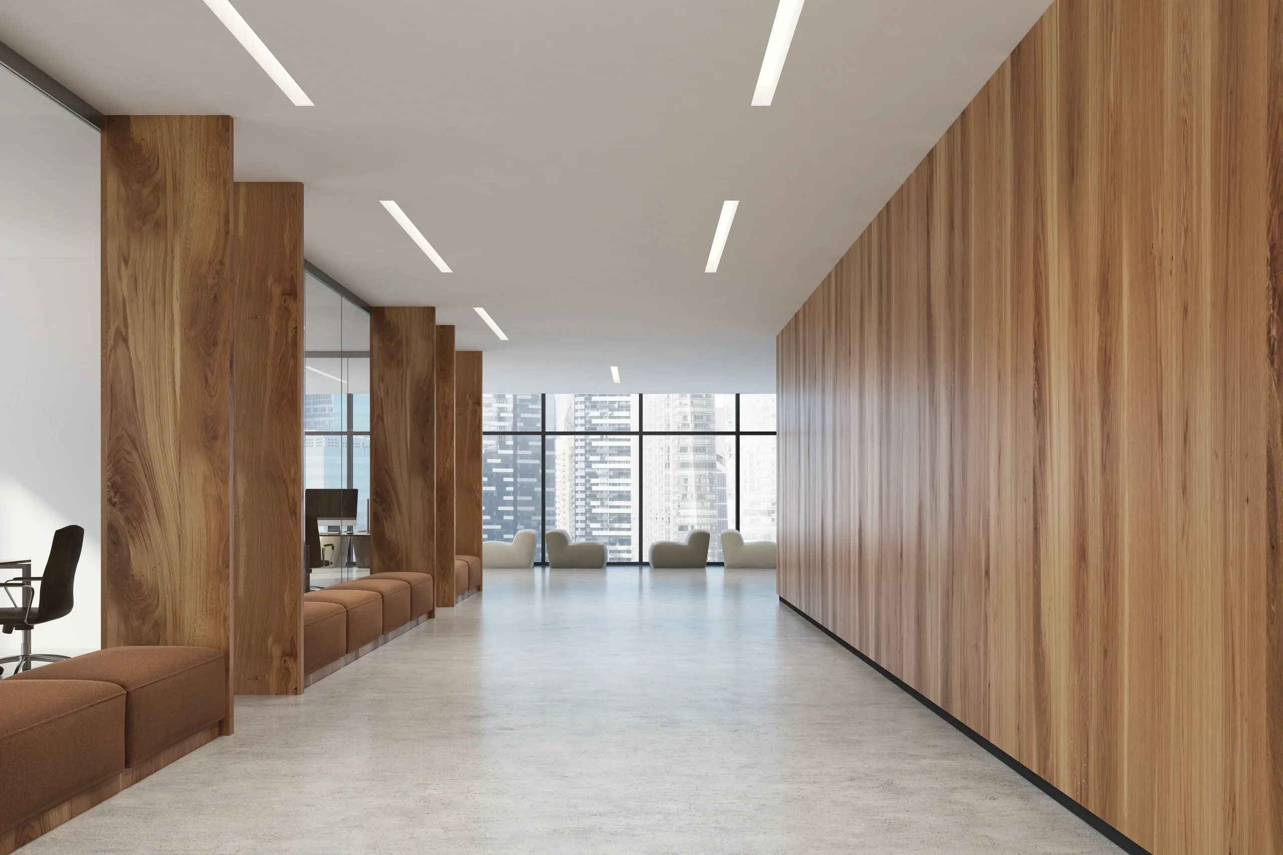 Modern office hallway with wood accents and comfortable seating.