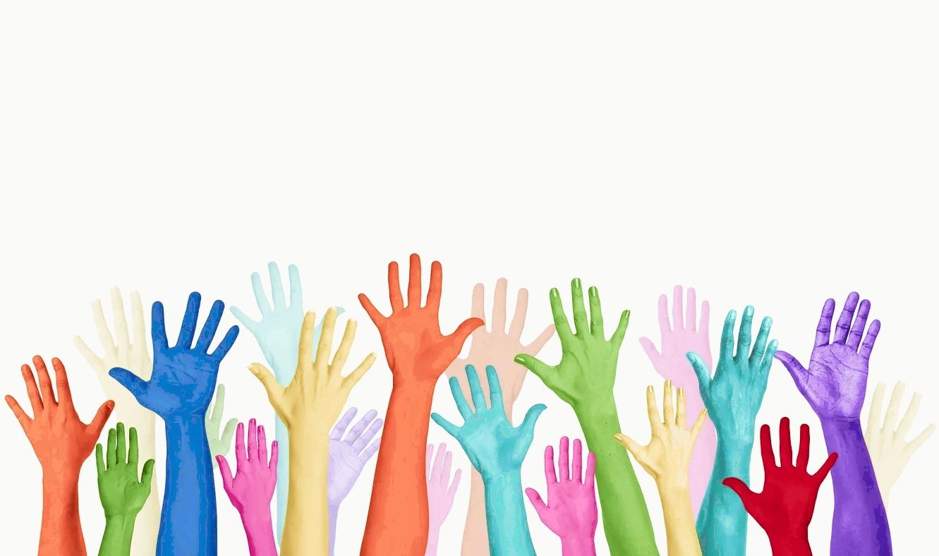 Colorful, raised hands of different sizes, symbolizing diversity and unity.