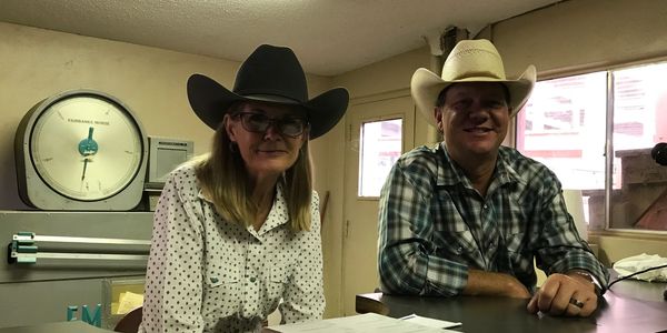 Round Mountain Horse & Tack Auction (RMHTA) Block Clerk, Trish Knawpp pictured with Cass Ringelstein