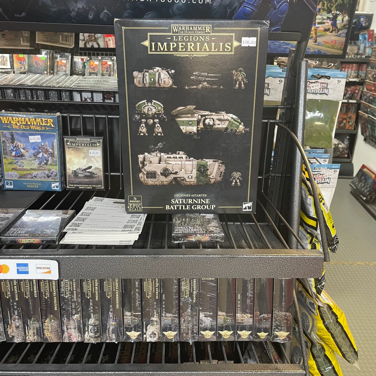 Warhammer Legions Imperialis Saturnine Battle Group boxed set on display in a store.