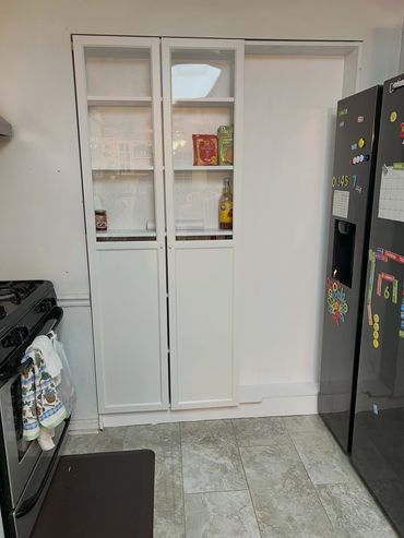 custom build wall with shelves with Ikea glass doors