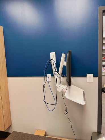 wall mounting a computer station for clinic