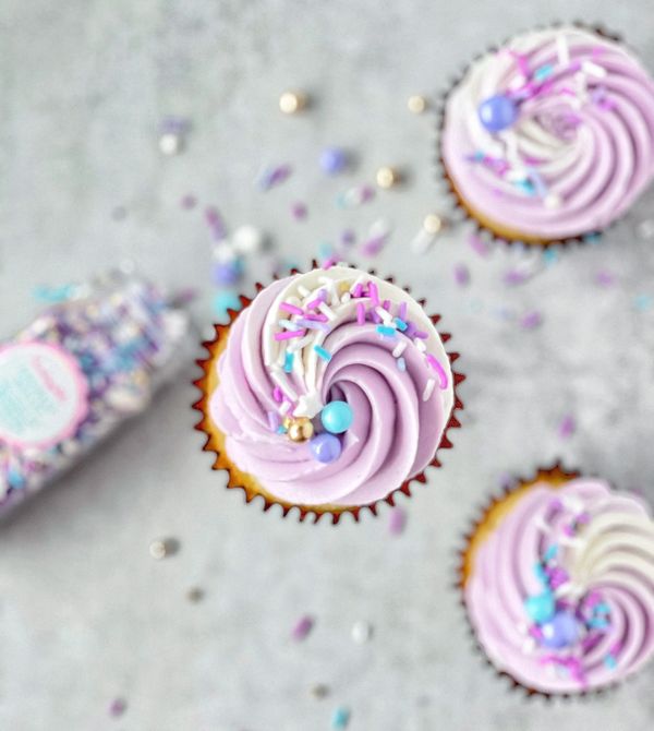 Lavender and white swirled cupcakes with purple and blue Sweetapolita sprinkles