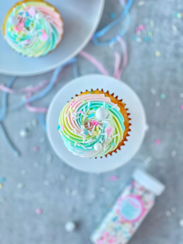 Pastel rainbow swirl cupcakes with Sweetapolita sprinkles.