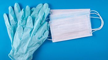 A picture of some gloves and masks on the table