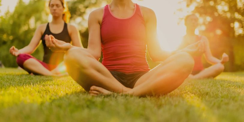 A group of young women performing Yoga