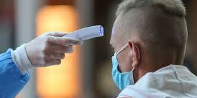 A picture of medical professional checking body temperatures