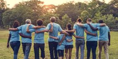 A picture of a group of people holding onto each other