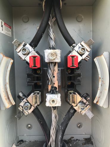 THE CENTER NEUTRAL LUGS ARE CORRODED DUE TO THE WATER LEAKING IN THE METERBASE