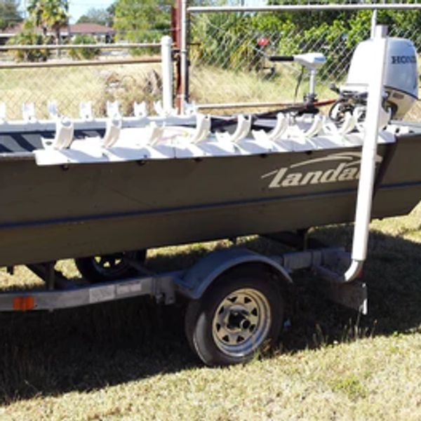 Katydid Fishing Products triple bay rod holders reconfigured to fit a round railing of a boat.