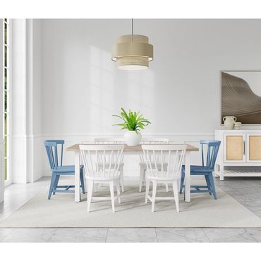 Modern dining room with white and blue chairs and a wooden table.