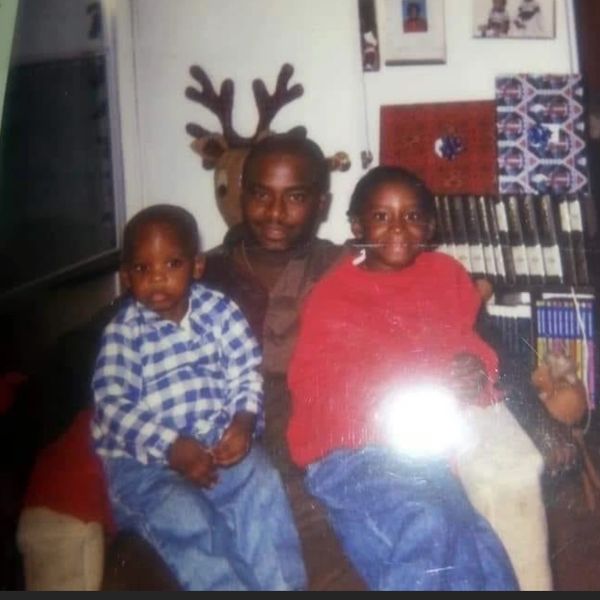 Chucke holding Huncho and his sister.
