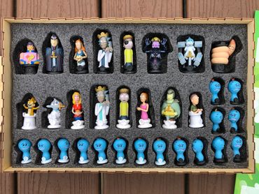 chess pieces in foam insert.