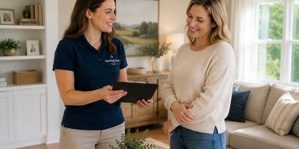 A SterlingClean representative talking to a customer in their home.