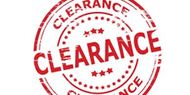 Red clearance stamp with stars.