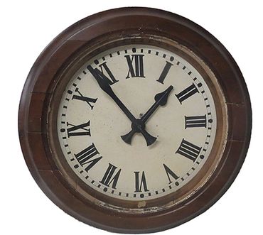 Round, electric wall clock in wood frame metal hands, dial,  roman numerals.