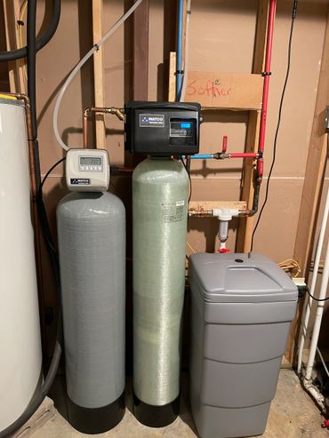 Complete water filtration installation of a Water Softener and Iron filter.