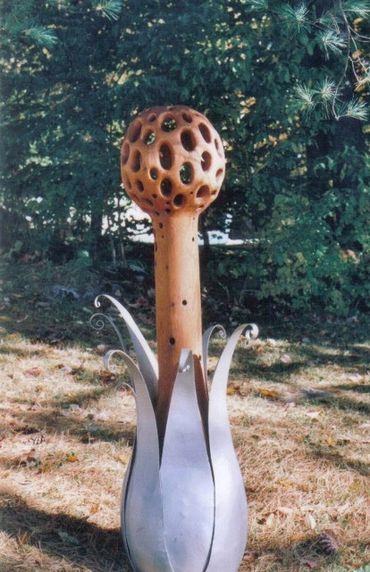 Anick Boulet Sculpture bois québécois organique nature métal sculpteur meilleur scie éruption fleur