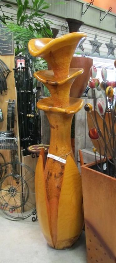 Anick Boulet Sculpture bois québécois organique nature métal sculpteur meilleur scie éruption fleur