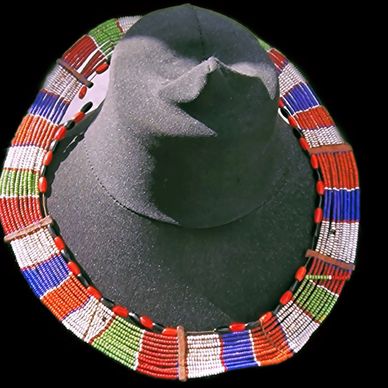 Traditional beaded necklace with black hat.