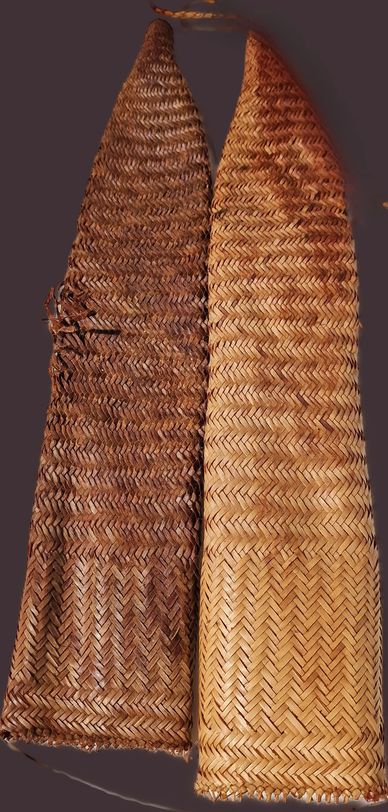 Two woven baskets with pointed tops.