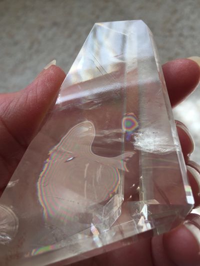 Clear quartz crystal with rainbows
