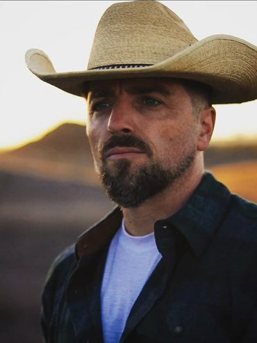 Chris Grant Wenchell - Western Actor Portrait in Cowboy Hat at Sunset - Gritty Cinematic Headshot