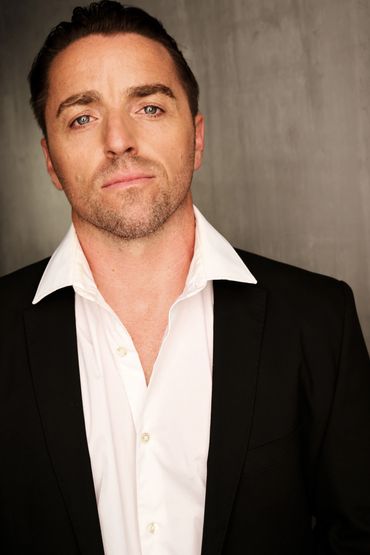 Chris Grant Wenchell - Professional Headshot in Black Suit - Actor and Film Producer