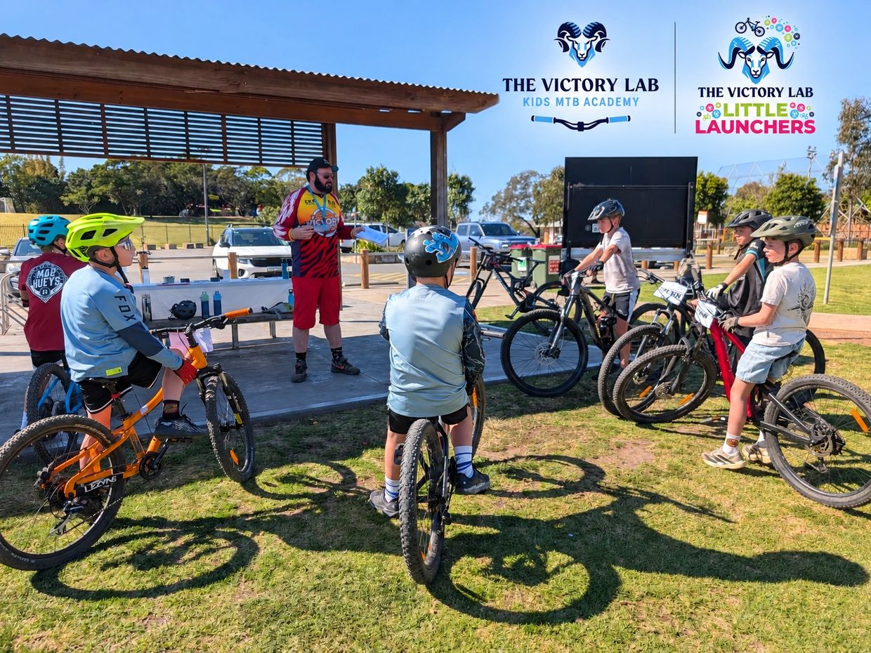 Kids attending a mountain biking class outdoors.