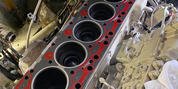 Close-up of an 6Bt Cummins in boat top end repairs.