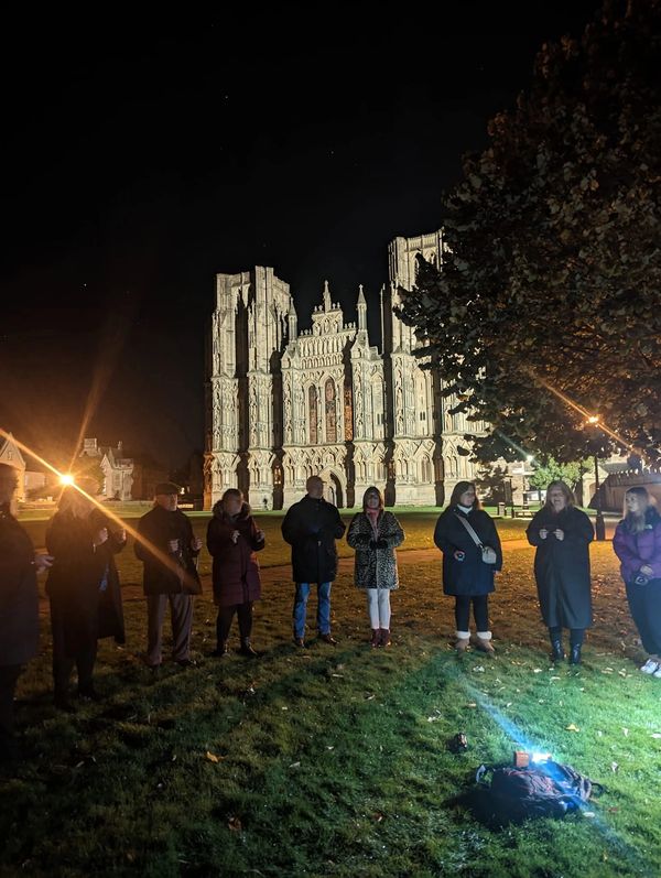 Group standing in front of Wells Cathedral enjoying the Wells Ghost Galk