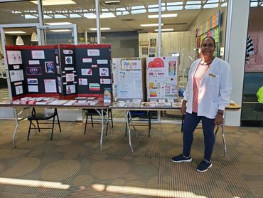 Nurse with health display.