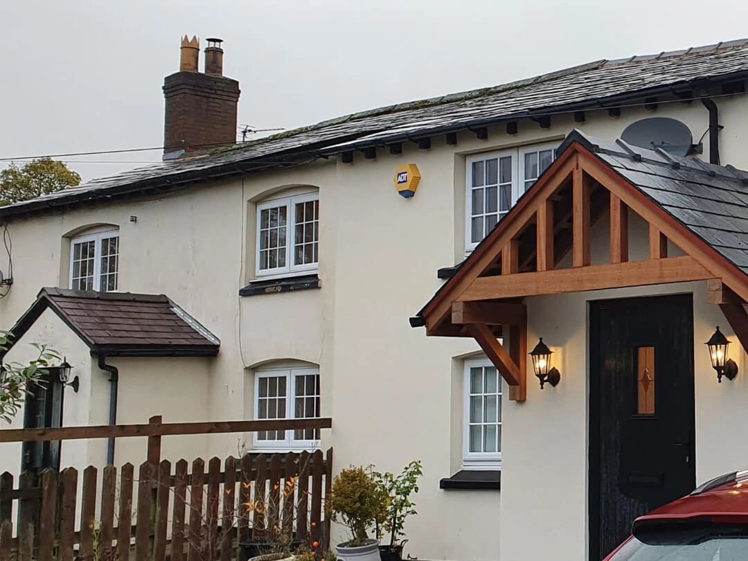 slate roof and timber canopy to new porch extension