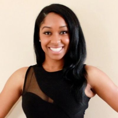 Image of founder, Trayonna Rankins. Wearing black dress.