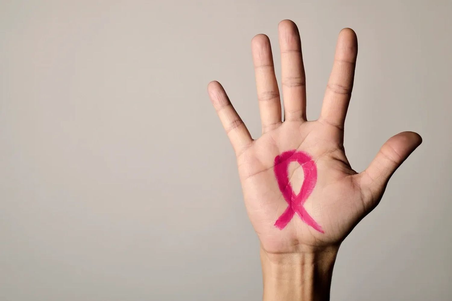 Breast cancer pink ribbon logo.