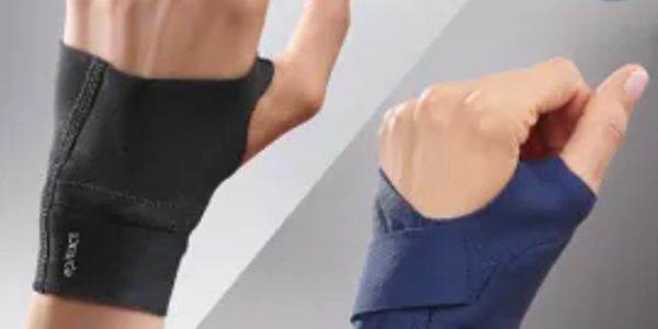 Two wrist supports on hands, one black and one blue.