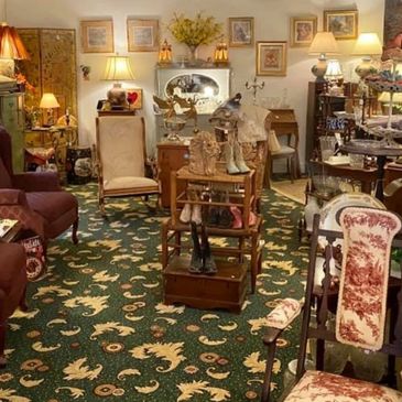 Antique shop filled with vintage furniture and decorative items.