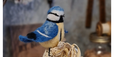 A little handmade bluebird that lives in our sewing room.