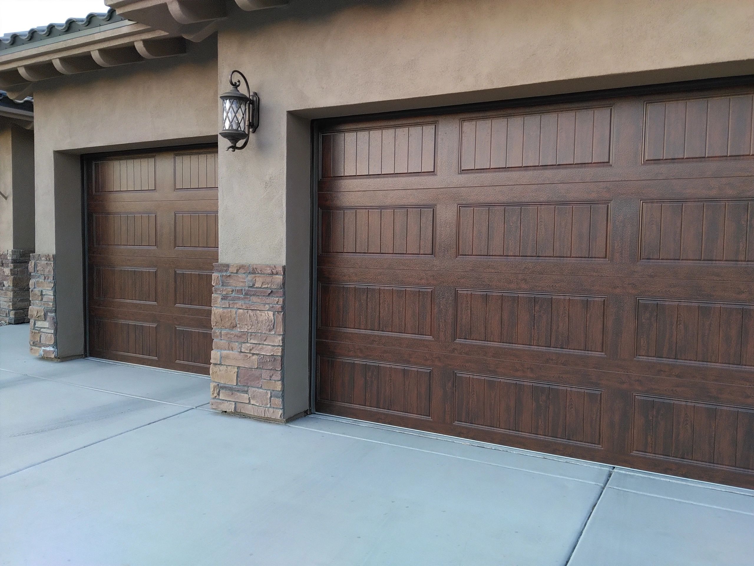 Wood look garage doors with Ranch style configuration, carriage house option. Boulder City NV