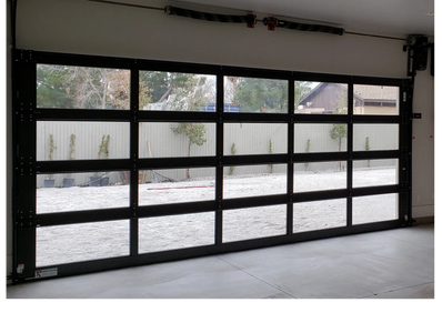 Full View Glass and Aluminum Garage Door paired with Residential side mount Opener.