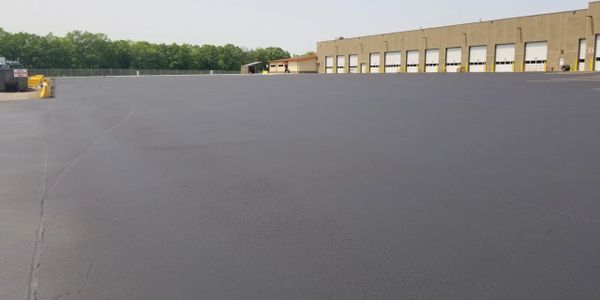 Seal coat/ crack seal of a large Trucking company over 15 Acers of Asphalt!