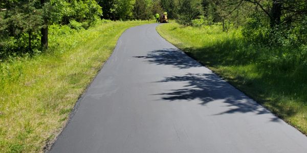 county park Bike path seal coated using the double coat method   