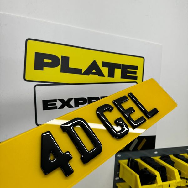 Yellow license plate with black 3D characters reading '40 GEL'.